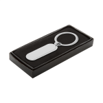 Přívěšek na klíče ve tvaru kapsle v krabičce Circus stříbrná